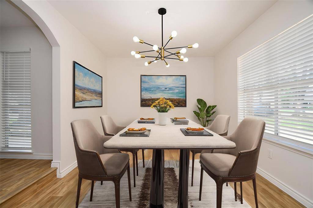This photo has been virtually staged. Dining room/Office.