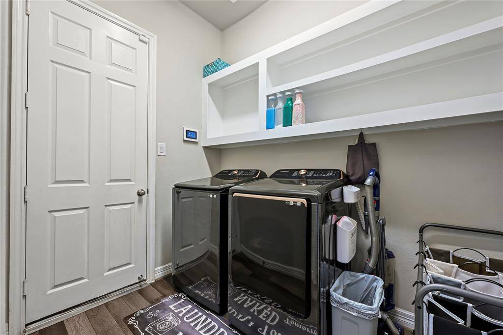 Large laundry room with lots of shelves
