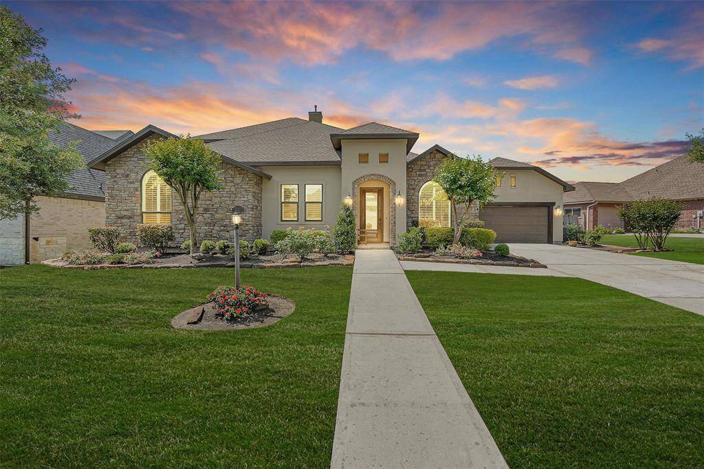 Welcome to 122 Club Island Way—this Mediterranean-style beauty sits in the prestigious gated Bentwater community. Beautiful stucco and stone accents, manicured landscaping, and an oversized driveway offer instant curb appeal.