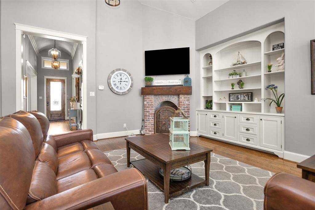 Stunning wood floors, neutral tones, and architectural details create a warm and upscale feel in the heart of the home.