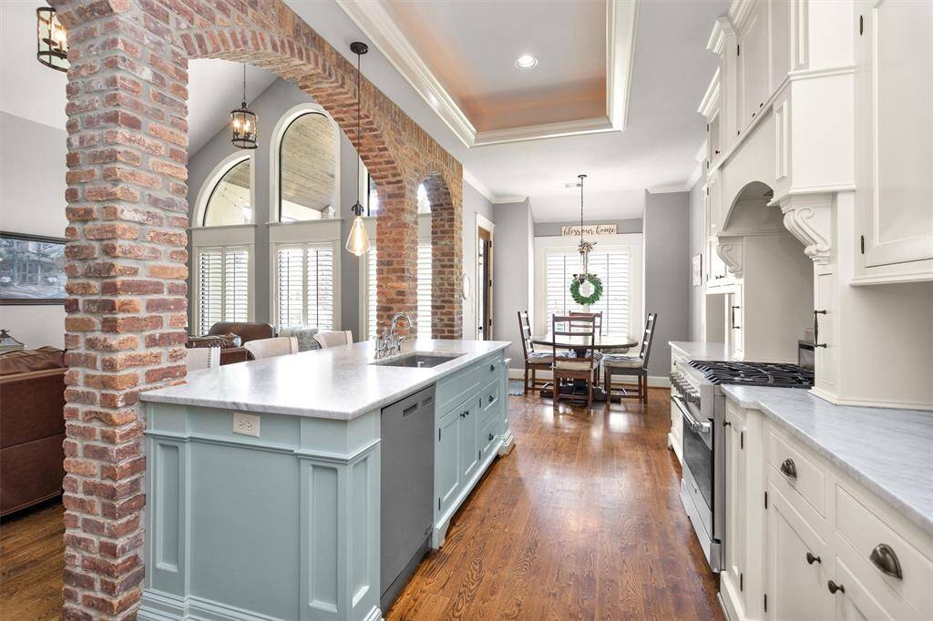 The kitchen opens directly into the breakfast nook and living room, making it easy to stay connected while preparing meals.