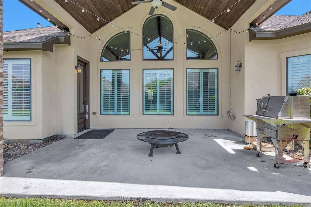 Enjoy outdoor living on the covered back patio with a sprinkler system and well-maintained yard—great for grilling, relaxing, or playtime.