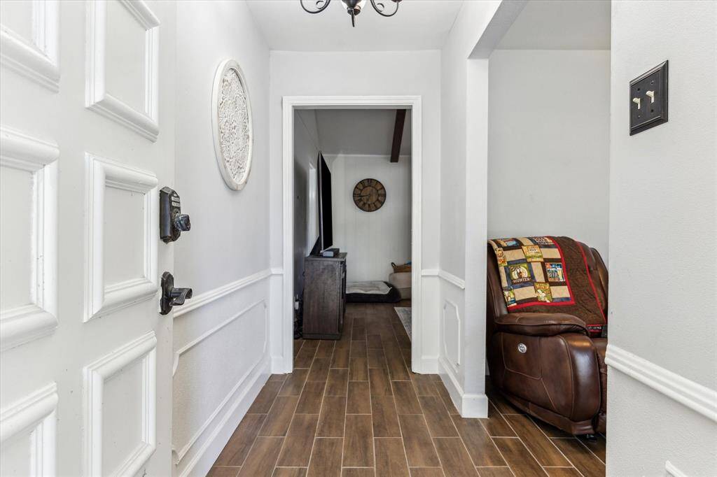 From the entryway, you can easily access both the living room and the den/office located to the right.