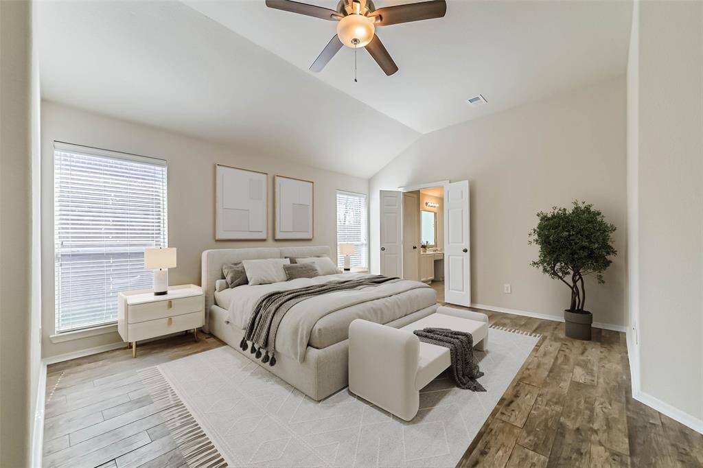 The primary bedroom offers a private en-suite bath