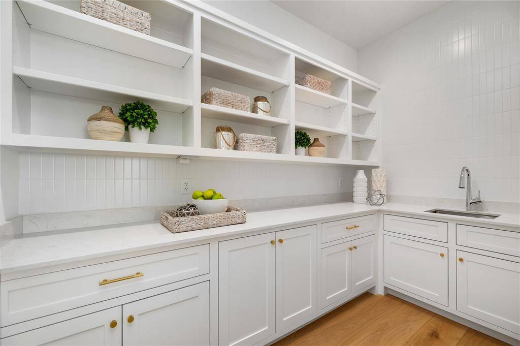 Large Working Pantry has great storage and a sink