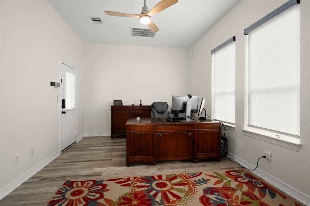 Room to the Right of the home across from the gate. 5th bedroom/guest quarters/ study.