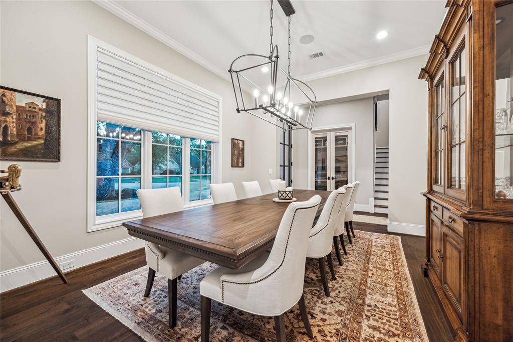 Located across from the study, this elegant space features large windows overlooking the front yard, flooding the room with natural light. Perfectly sized to accommodate a large table, with ceiling speakers for ambient dining.