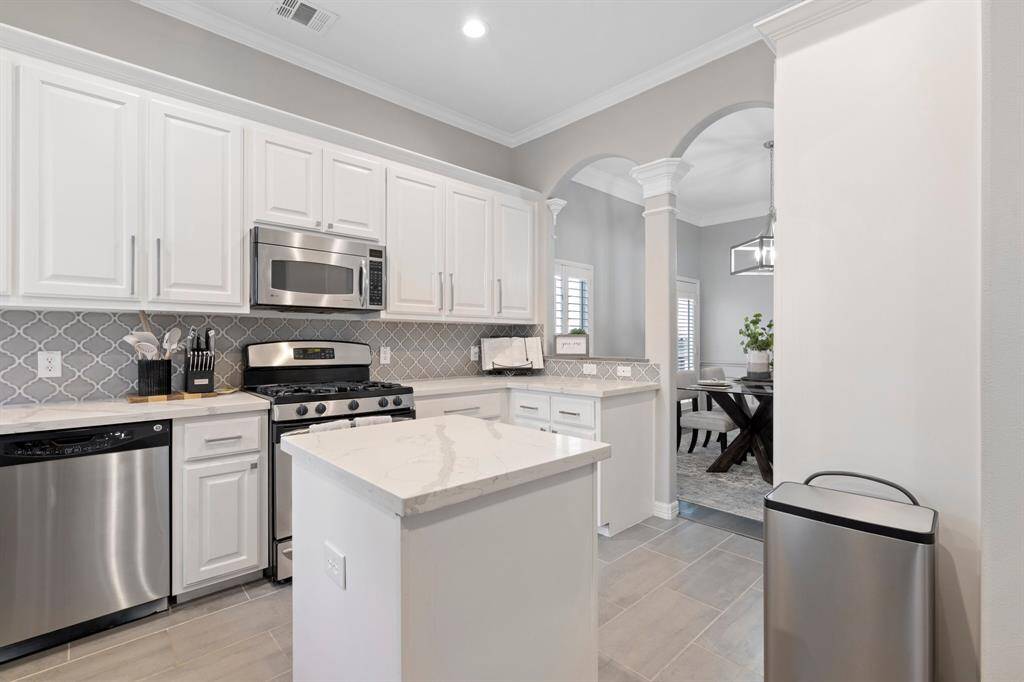 Light and bright kitchen with pantry, plenty of storage and counter space.