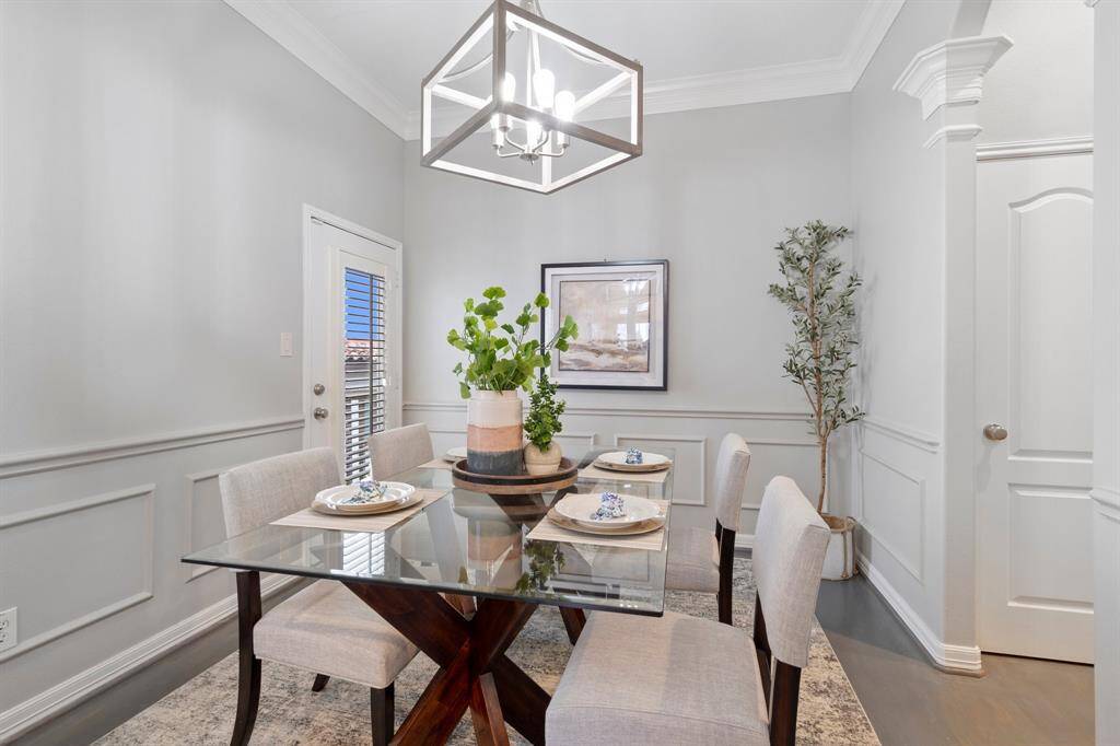 Large dining room right off the kitchen. Door leads to second floor balcony which allows for ease when wanting to grill out!