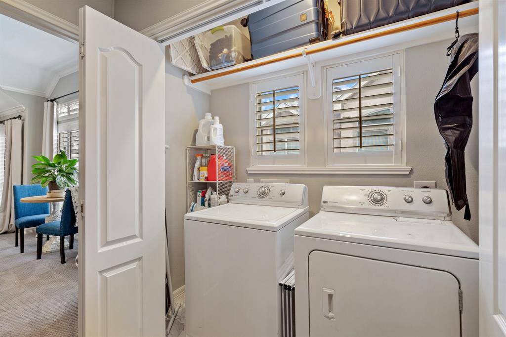 Laundry room located on third floor between primary and secondary bedroom. Upper storage space is an added bonus!