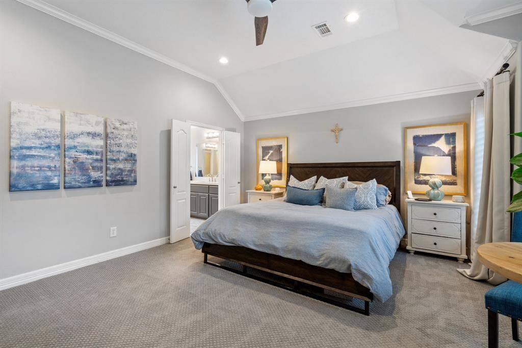 Great size primary bedroom with tons of natural light, high ceilings, ceiling fan and sitting area