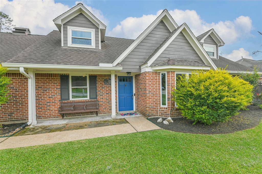 Brick on all 4 sides of this home. Enter through a covered front "porch" with a built-in bench. Garden beds on either side give you a place to experiment with your green thumb.