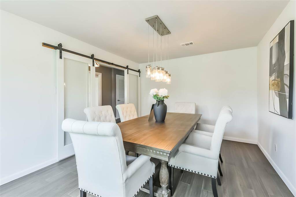 Framed glass barn doors can be closed for privacy! An updated french door feel!