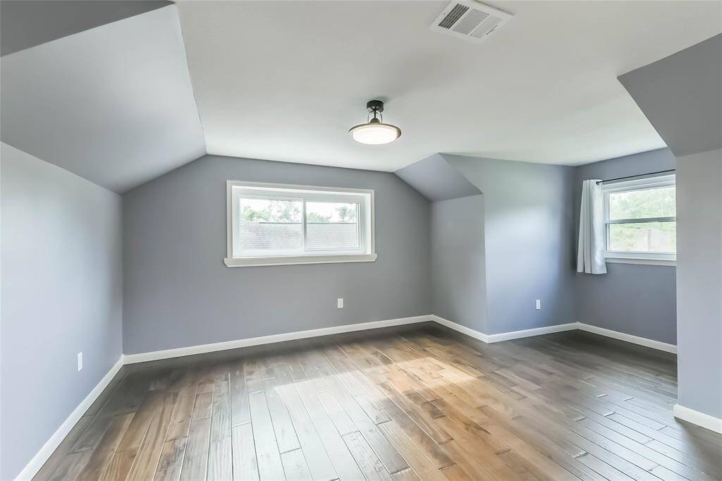 The second bedroom is at the top of the stairs. Dormer windows expand the space. Beautiful hand scraped laminate flooring! Double pane windows up here too!