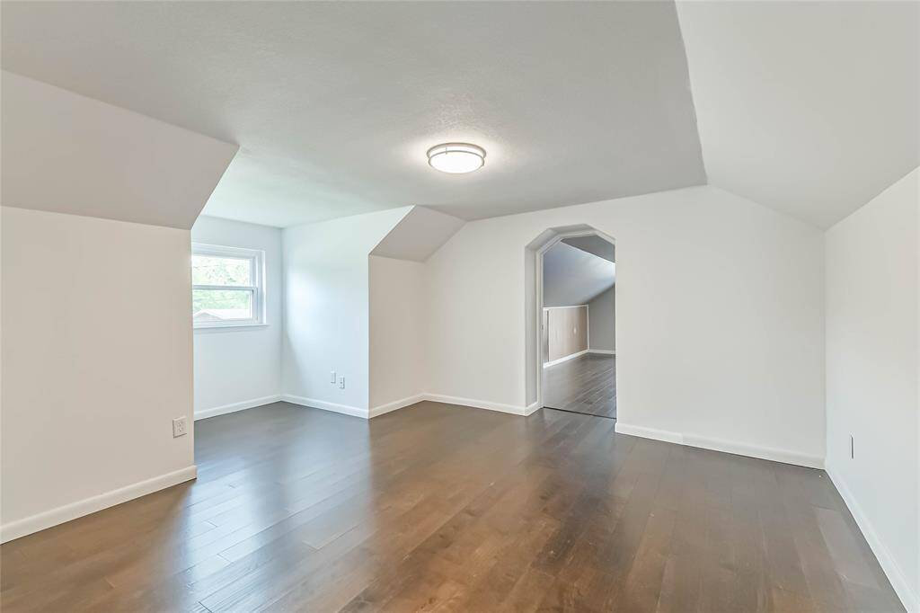 This is the third bedroom in the middle of the upstairs. Again, dormer windows add to the space and light in this room. Vaulted ceilings, hand scraped laminate floors.