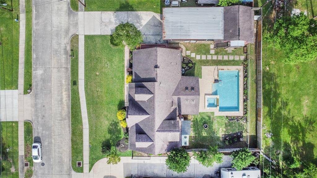 This property is NOT just a home. There is the barn, carport, screened in covered patio and the beautiful pool. All on a HUGE lot!