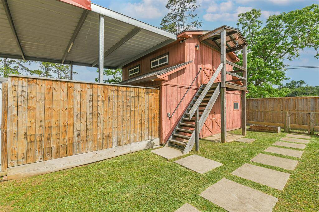 The barn and the TALL, oversized carport!