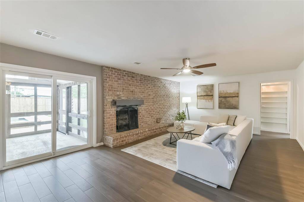 Main living area with fireplace/brick wall provides a warm, cozy feel. You'll love the tile floors that are great for wet bodies coming in from the pool and easy care for pet owners!