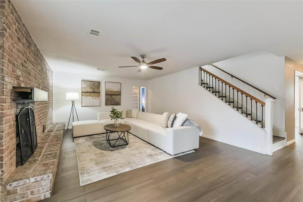 The living area will handle your larger furniture. Turn the sectional around and face the far wall if you'd like to mount a TV.