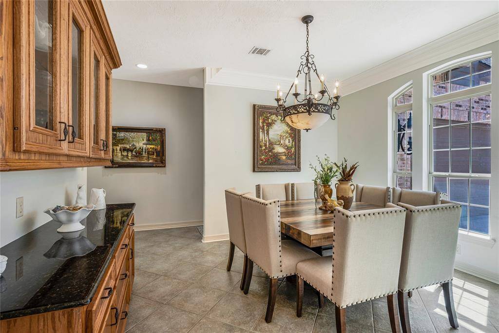 Natural light floods the dining area through the large windows.