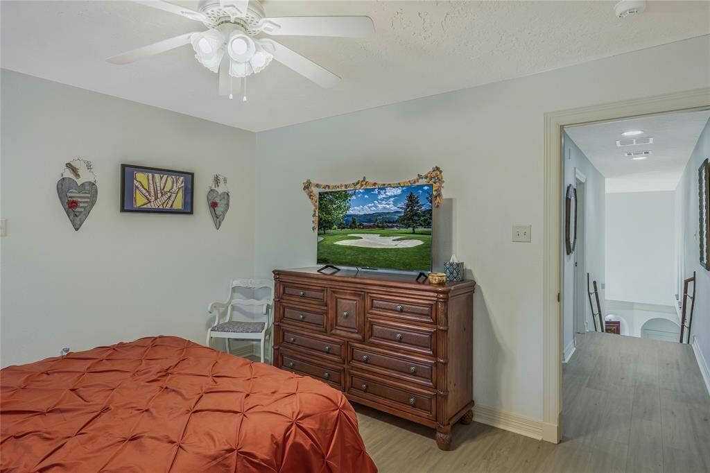 This cozy bedroom is located just off the hallway, which leads to other areas of the home.