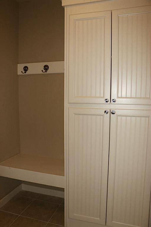 Laundry room with built-in bench area.