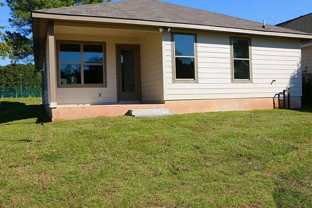 View of the back with covered back porch  area.