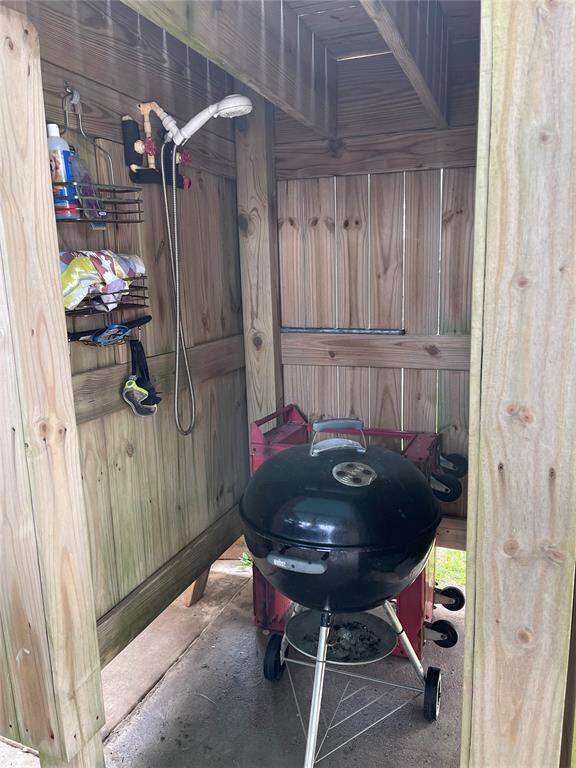 Downstairs shower and storage for the grill.