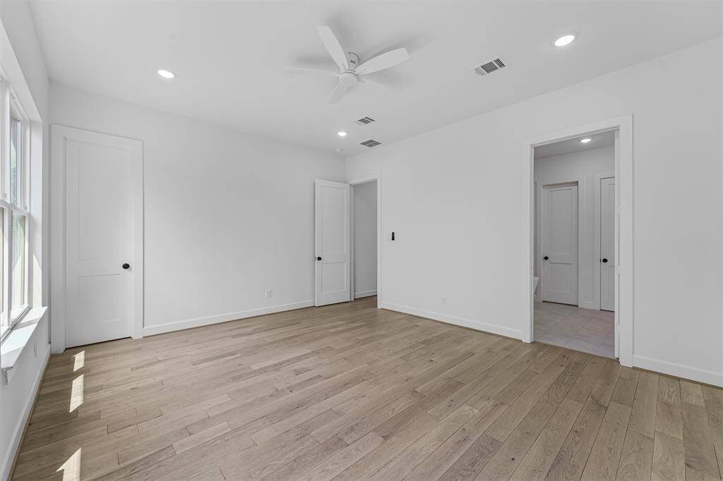 Another view of primary bedroom