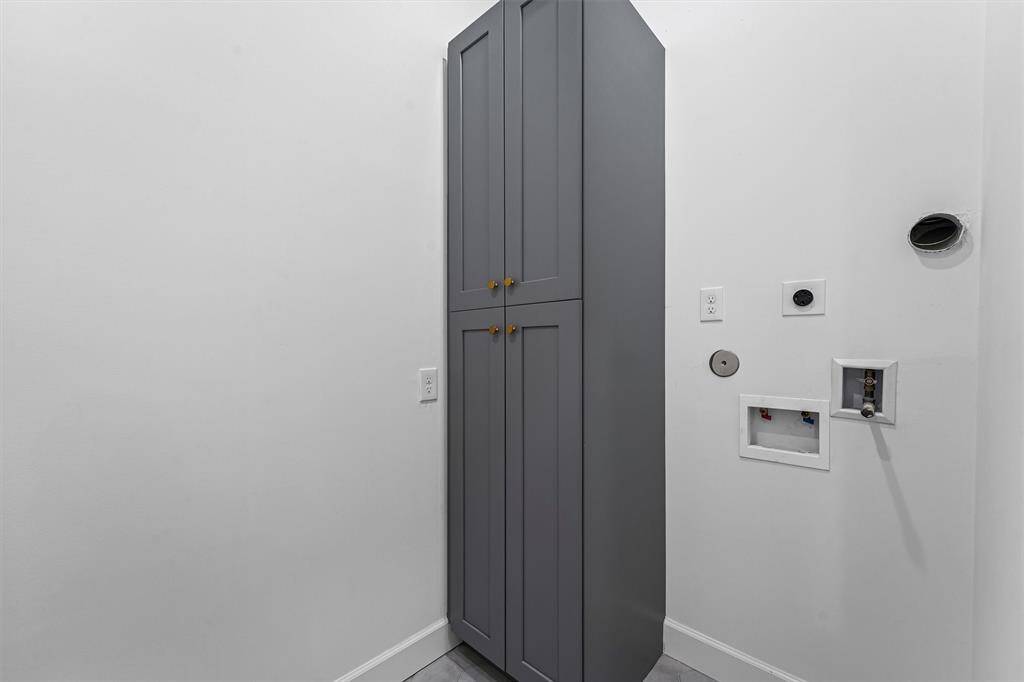 Laundry room with built in cabinets