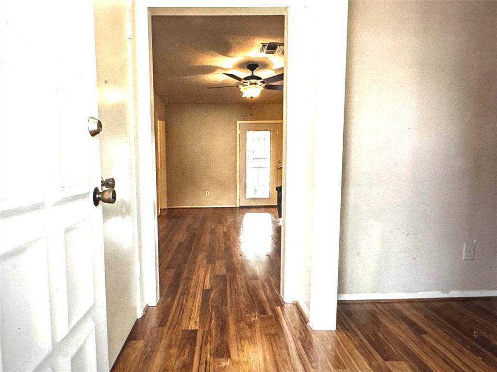 Welcome home! Office or dining area to the right of entry with sliding barn doors for privacy
