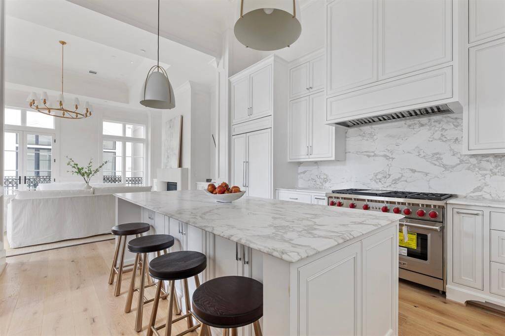 The gorgeous kitchen area features custom built cabinets with inset soft close doors and Emtek hardware.