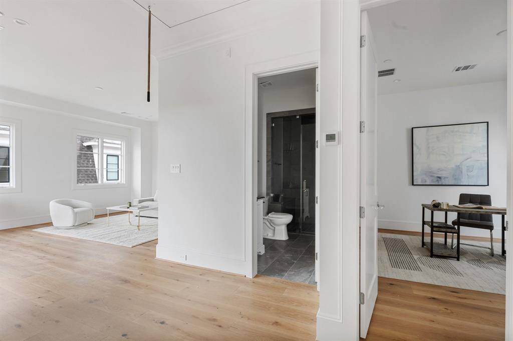 Lovely flexible top floor features the third bedroom as well as game room with wide doors open to the entertaining patio.