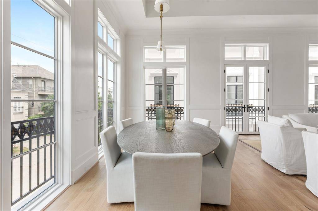 The whole of the expansive living area is lined large windows as well as a set of French doors which open to the Juliet balcony featuring intricate iron detailing.