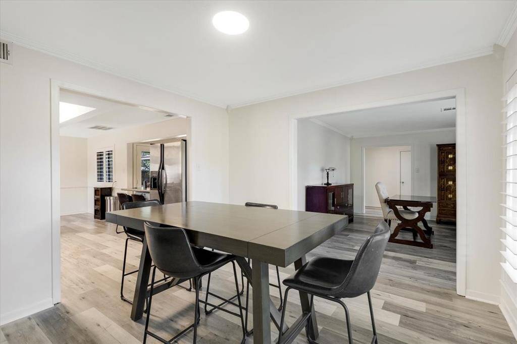 The dining room is spacious and open to formal living room and kitchen.