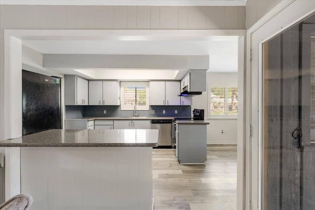 The kitchen is open to the breakfast area and family room.