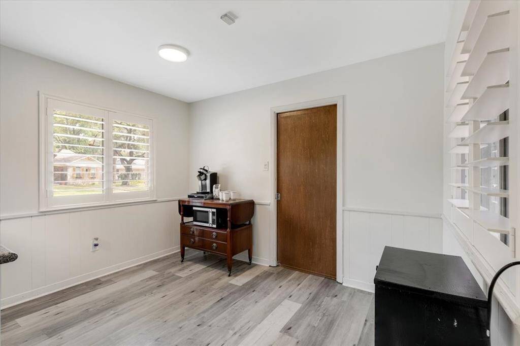 The breakfast area has fresh paint and flooring as well as beautiful plantation shutters.