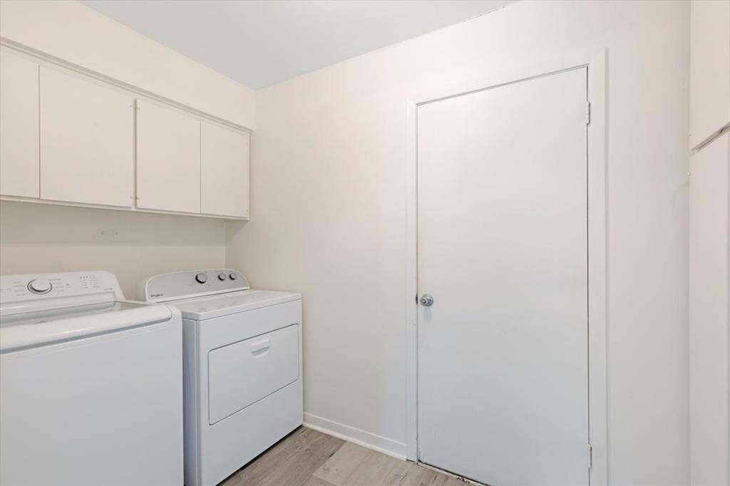 The laundry room can accommodate gas or electric washer/dryer.  It has ample storage with built in shelving and cabinets.
