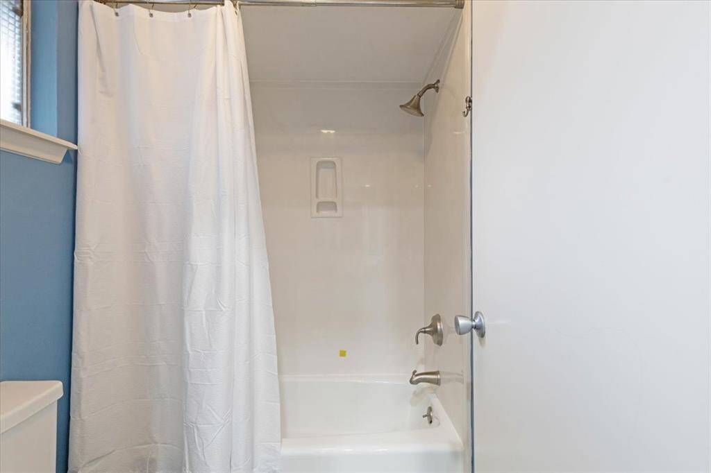 The hall bathroom includes a shower-tub combo.