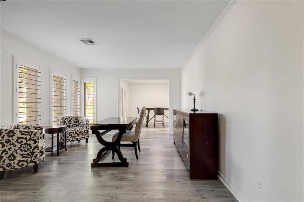 The formal living room is versatile.  It is currently being used as an office space.