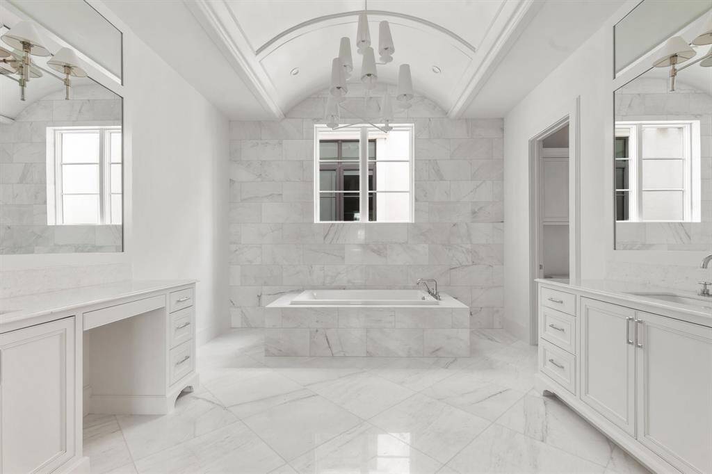 Unwind in the comfort of the built-in soaking tub, designed to offer a relaxing retreat with its timeless elegance and functional style.