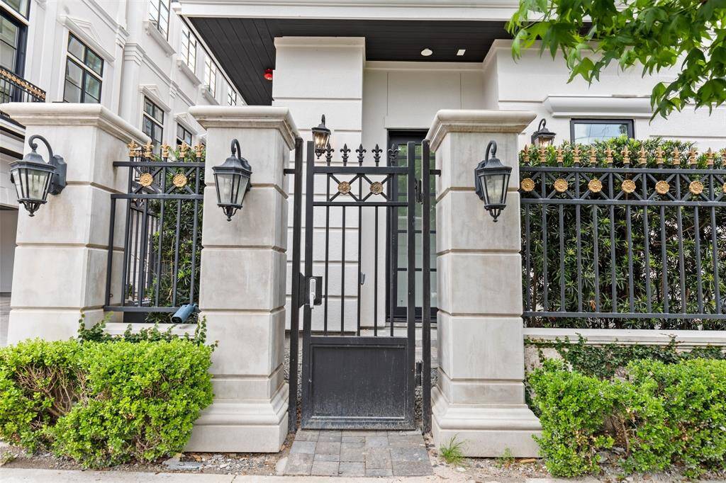 The home's private access gate with keypad entry ensures security and peace of mind, welcoming guests with convenience and control.