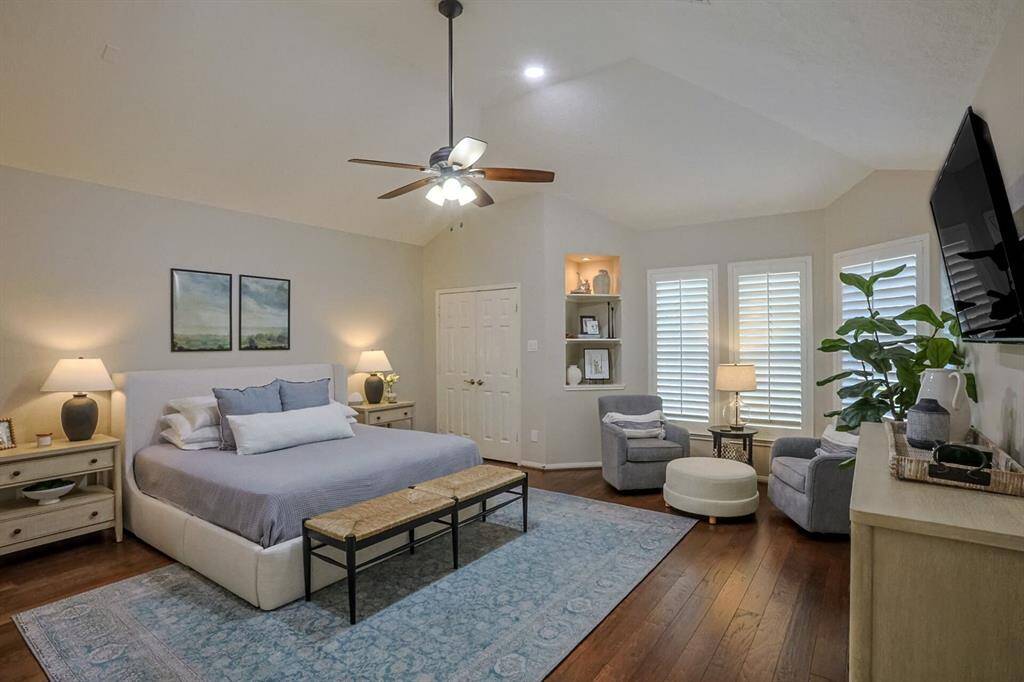 Over sized primary room with sitting area to enjoy a great book or views of the stunning pool and backyard!