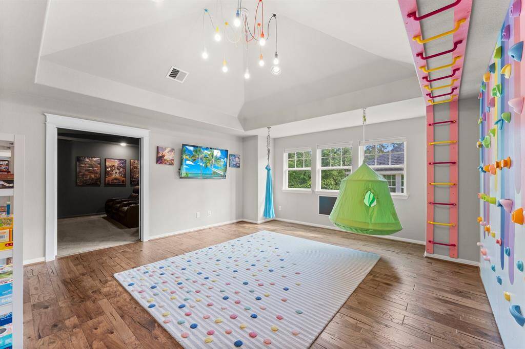 Game room. 2nd floor.Custom rock wall built in.
