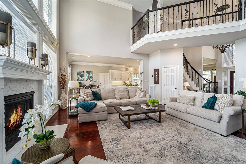 This view highlights the seamless flow between the expansive living room, adorable breakfast nook, and kitchen—offering an open, airy layout ideal for gatherings, relaxation, and modern living.