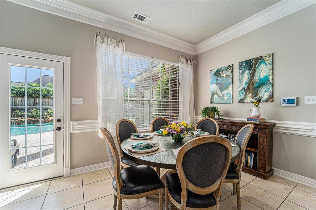Charming breakfast nook with backyard views!