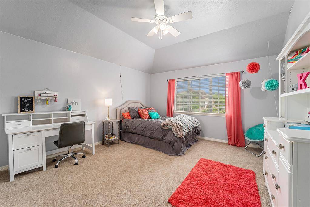 Spacious secondary bathroom with a walk-in closet.