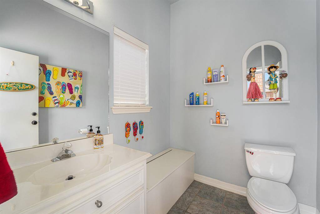 Half bathroom conveniently located by the pool.