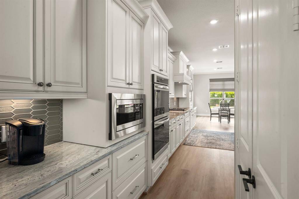 Built-in coffee bar offers a stylish and convenient morning routine space.