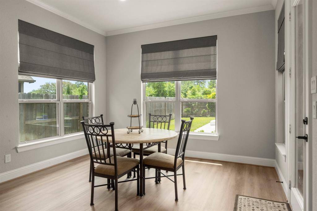 Tucked just off of the kitchen you will find the breakfast area with large windows and the door to the backyard.